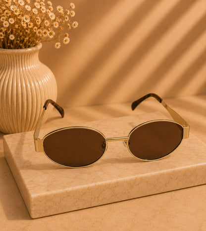 LUSHÉ Oval Sunglasses in gold with brown lenses