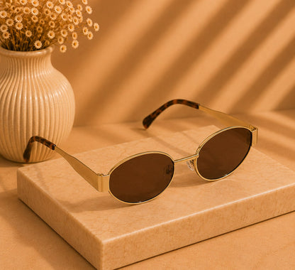 LUSHÉ Oval Sunglasses in gold with brown lenses
