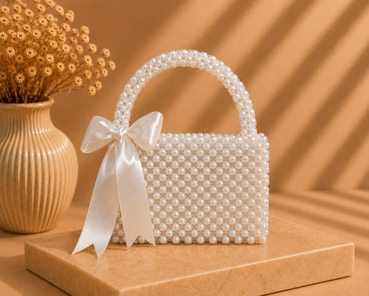 LUSHÉ Pearl Bow Bag in ivory with satin bow