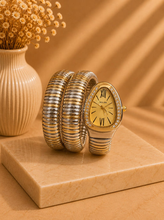 LUSHÉ Serpent Coil Watch in gold and silver with a crystal bezel
